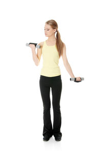 Full length portrait of woman standing against white background