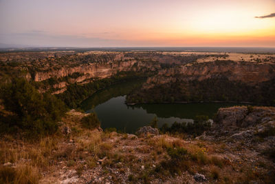 Scenic view of landscape against sky during sunset