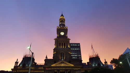 View of illuminated buildings against sky at dusk