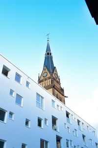 Low angle view of building against clear blue sky