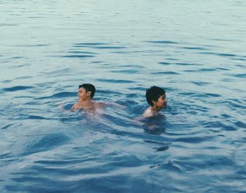 High angle view of man swimming in sea