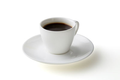 High angle view of coffee cup against white background