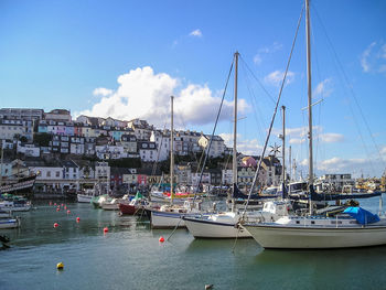 Boats moored at harbor