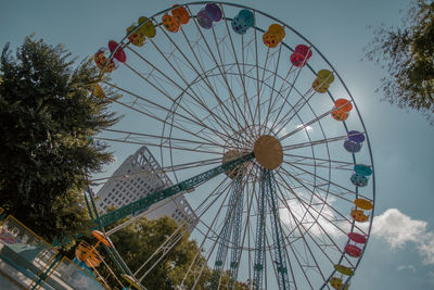 Low angle view of ferris wheel against sky