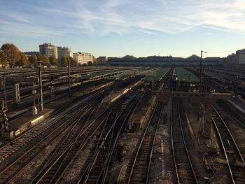 High angle view of railroad tracks in city against sky