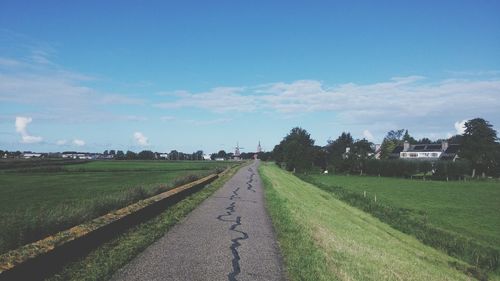 Road passing through field