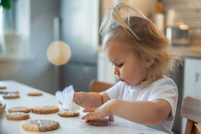 Close-up of girl making cookies