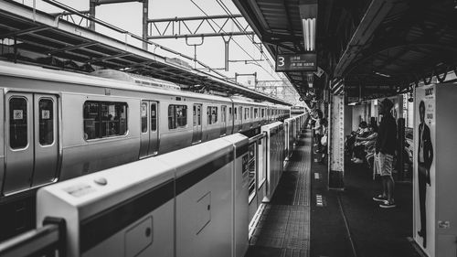 People waiting for train at station