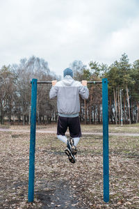 Outdoor pull-up bar and parallel bars workout. socially distant bootcamps. group fitness workout 