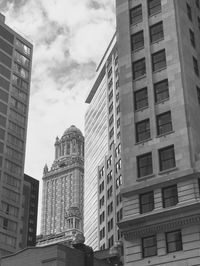 Low angle view of skyscrapers against sky