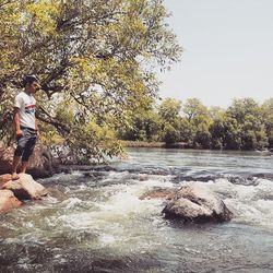 Woman standing on rocks