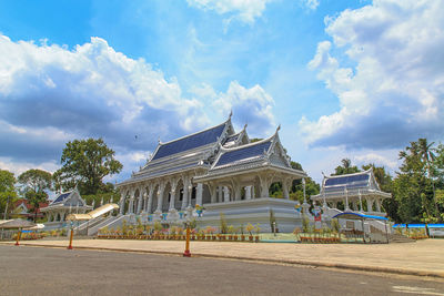 View of temple building against cloudy sky