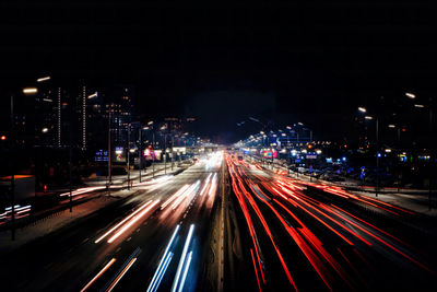 High angle view of light trails on road at night