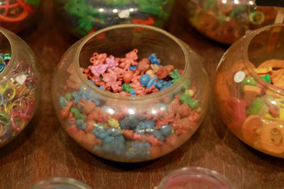 High angle view of candies in jar on table