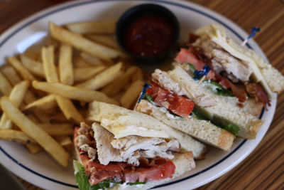 Close-up of food served with fries 