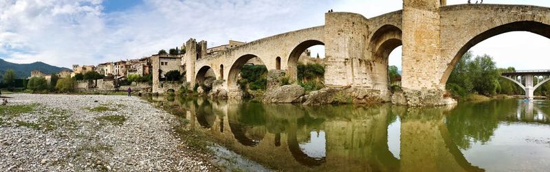 Panoramic shot of bridge over lake against sky