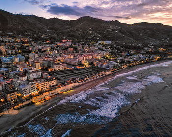 High angle view of city at sunset
