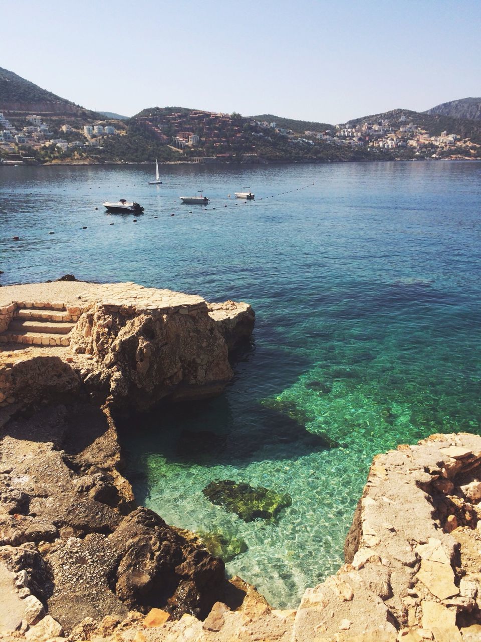 water, sea, tranquility, rock formation, rock - object, tranquil scene, nature, beauty in nature, scenics, high angle view, beach, cliff, rock, day, reflection, outdoors, coastline, shore, waterfront, idyllic