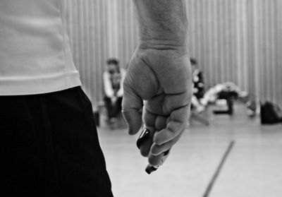 Midsection of man standing on floor