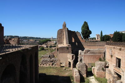Low angle view of temple against clear blue sky