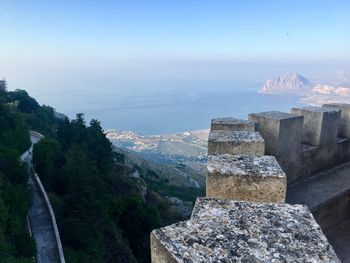 Panoramic view of sea and mountain against sky