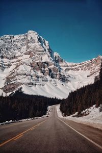 Road against snowcapped mountains 