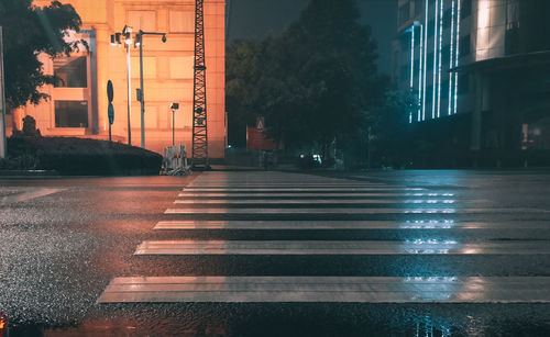 Wet street during rainy season at night