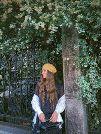 Portrait of woman standing in forest