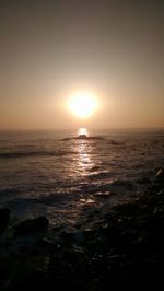 Scenic view of sea against sky at sunset