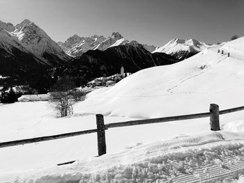 Scenic view of snow covered mountains against sky