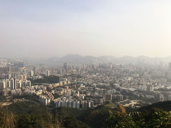 High angle view of city buildings against sky