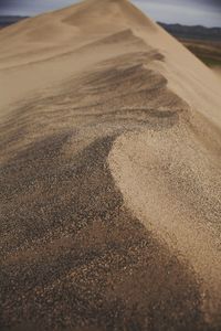 Surface level of sand on road