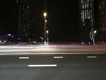 Light trails on road in city at night