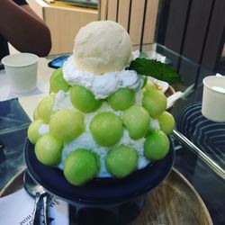 Close-up of ice cream served on table