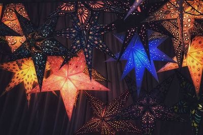 Illuminated christmas lights hanging at night