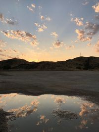 Scenic view of lake against sky during sunset