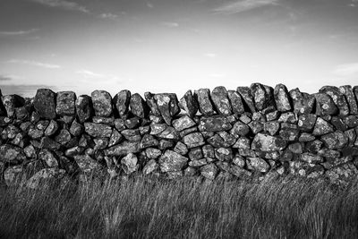 Dry stone wall against sky