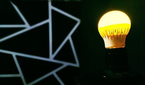 Close-up of illuminated light bulb