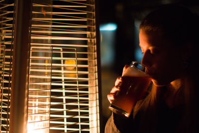 Blonde woman drinking beer