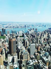 Aerial view of cityscape against sea