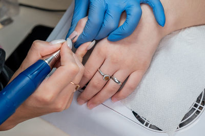 Cropped image of doctor examining patient