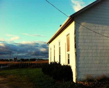 Buildings against cloudy sky