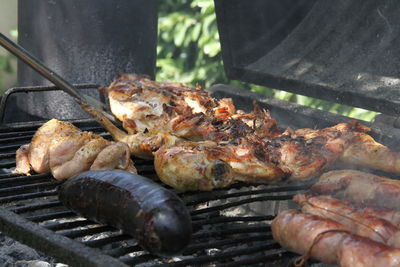 High angle view of meat on barbecue grill