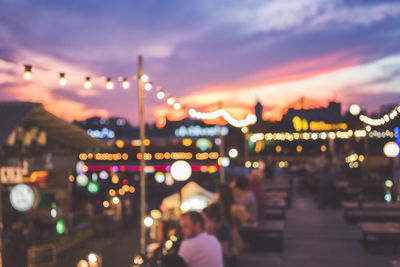 Defocused image of illuminated city at night