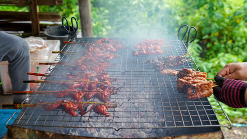 High angle view of meat on barbecue grill