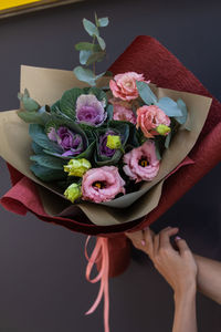 High angle view of woman holding rose bouquet