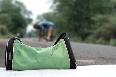 Close-up of metallic structure against trees