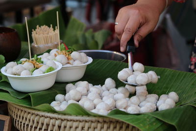 Midsection of man preparing food