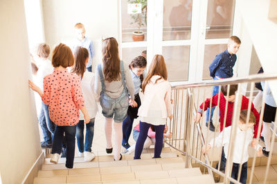 Group of people standing on tiled floor