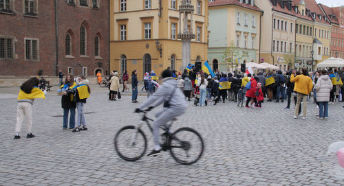 People walking on street in city